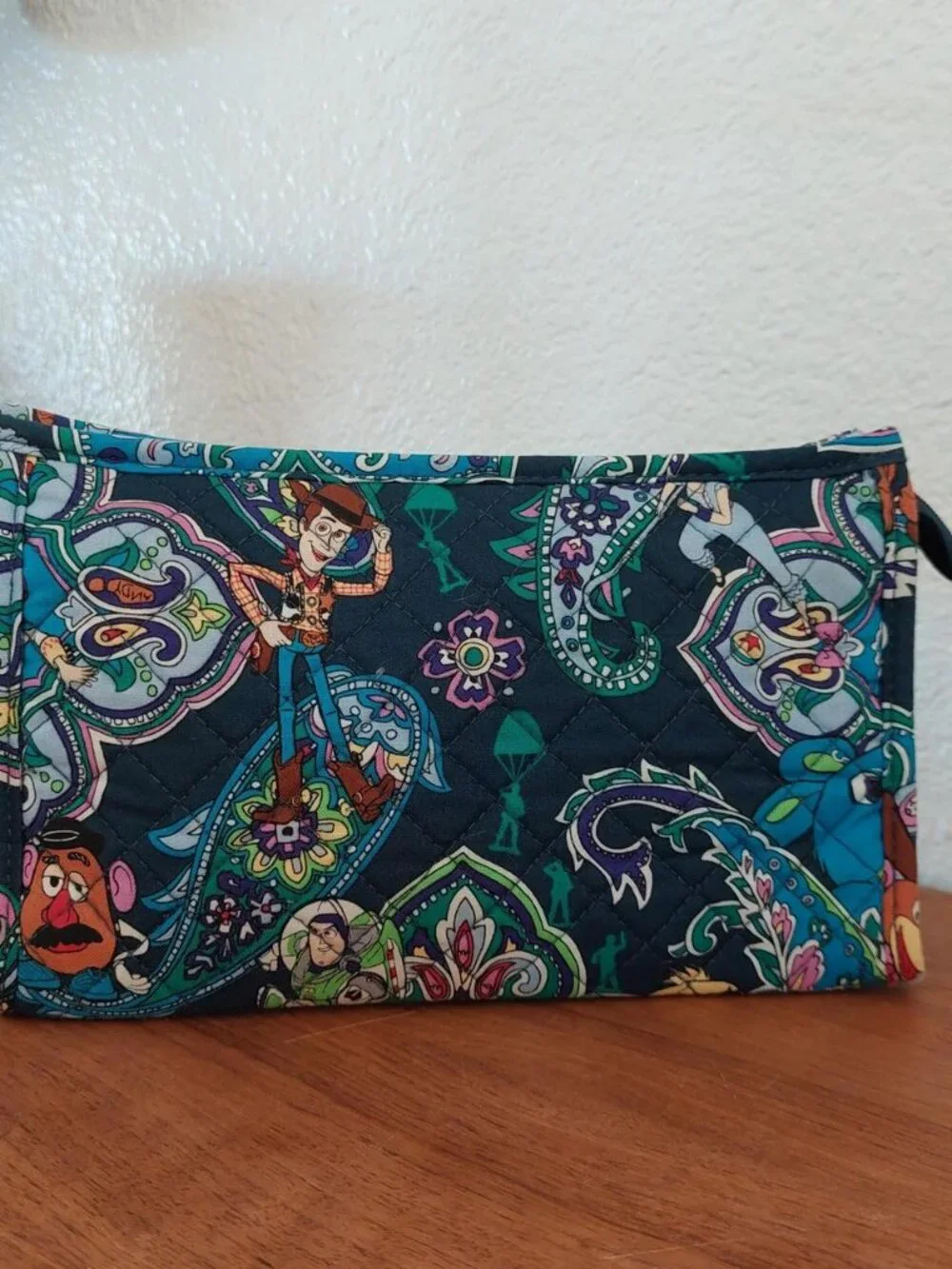 vera bradley Disney Toy Story quilted pouch with characters in a paisley design